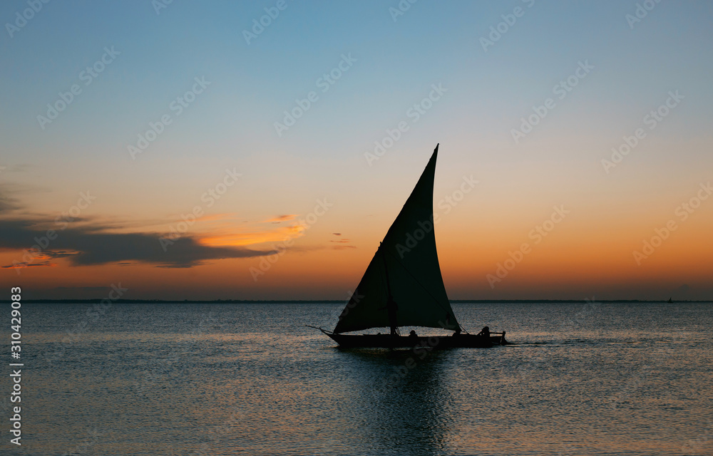 Sailboat at sunset. Beautiful background for posters, blogs, web design. Travel and vacation concept.