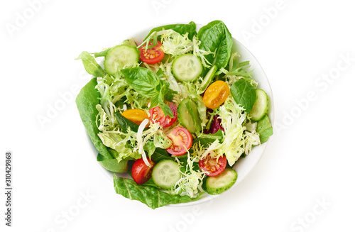 Fresh vegan salad with cherry tomatoes isolated on white background. Top view with copy space.