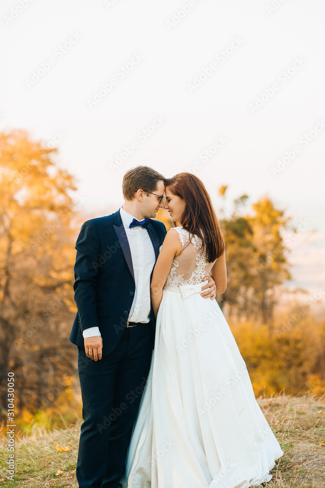 Romantic couple bride and groom sensual hugging