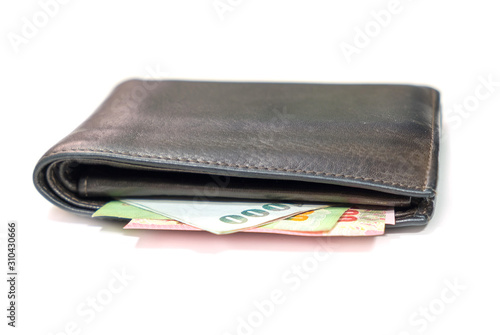 brown leather wallet with thai banknotes on white background.