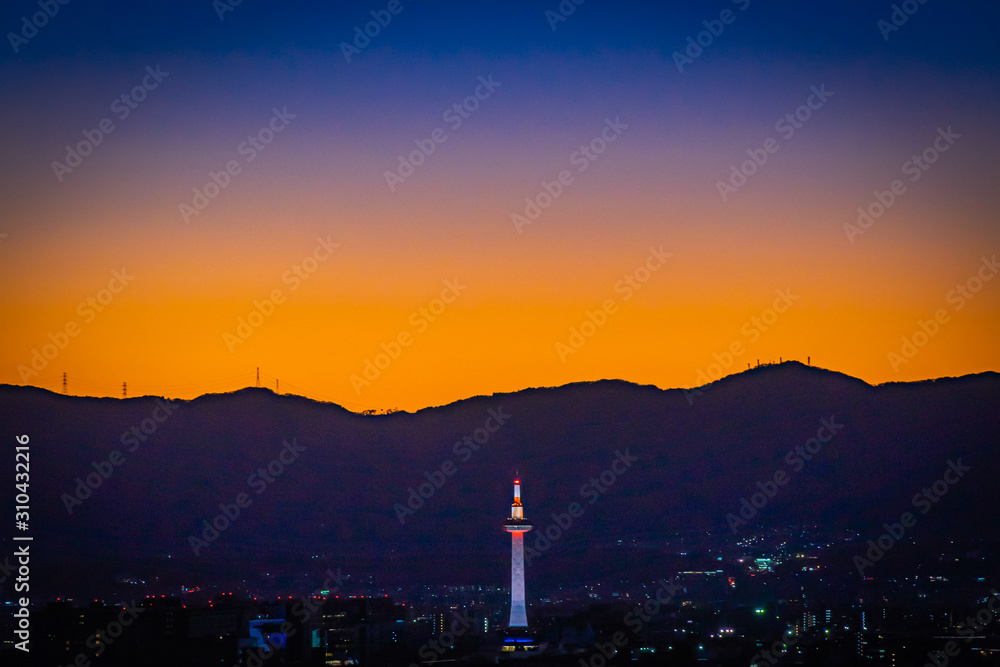 Kyoto tower at dusk when sunset time in Kyoto, Japan.