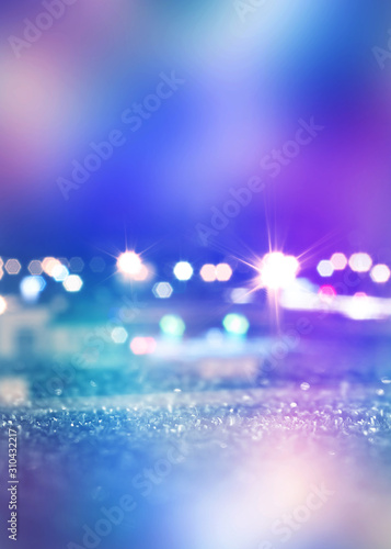 Abstract background. Defocused lights of the night city. Brilliant festive background with neon glow. © Laura Сrazy