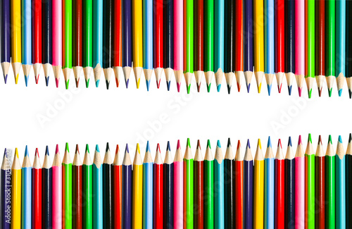 Color pencils lying on white background. Back to school concept. Colorful art studying and painting process. Drawing with pencils. Copy space place for postcard wish.