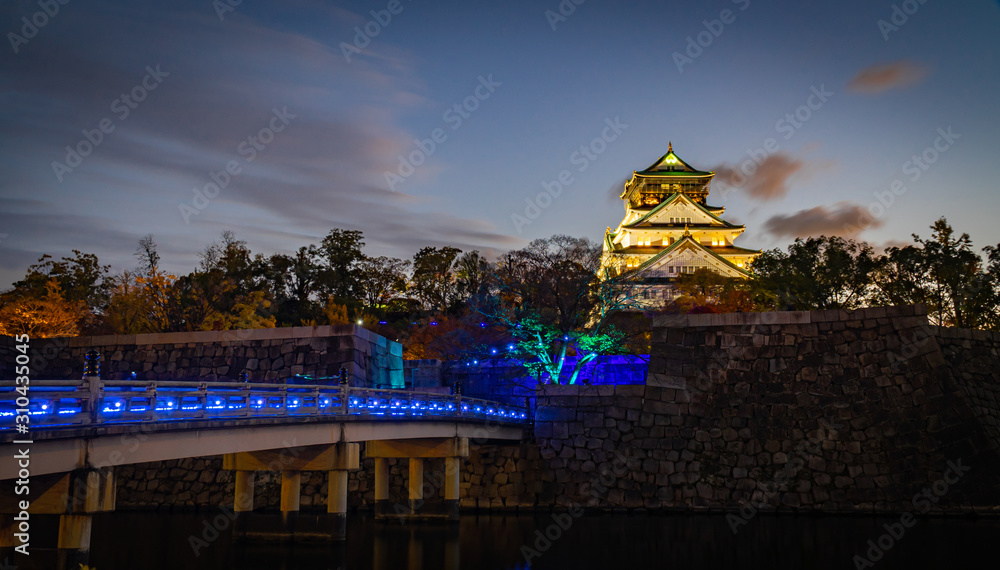 Osaka Castle or Himeji Castle at dusk decorated the light on the bridge in Christmas event. Osaka Castle or Himeji Castle at dusk decorated the light on the bridge in Christmas event.