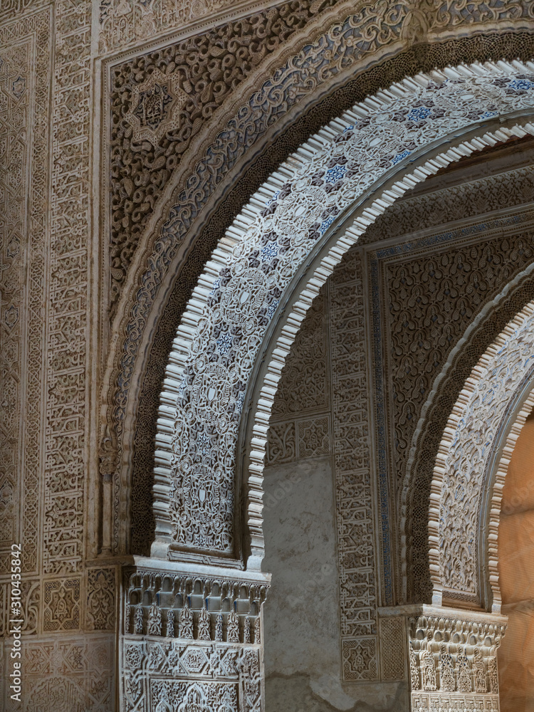 Arches and column of Nasrid Palaces, Alhambra, Granada, Spain