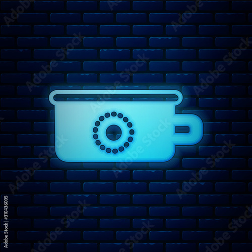 Glowing neon Baby potty icon isolated on brick wall background. Chamber pot.  Vector Illustration