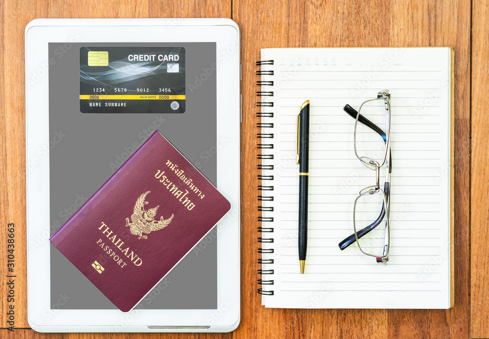 Airplane by passport and cellphone with notepad Airplane by passport and cellphone with notepad