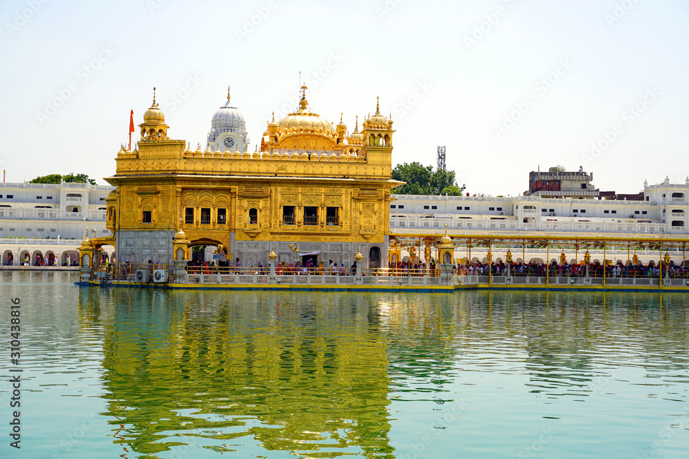 Amritser, Punjab / India - May 30 2019: The Harmandar Sahib also known as Darbar Sahib, is a Gurdwara located in the city of Amritsar, Punjab, India. It is the preeminent pilgrimage site of Sikhism.