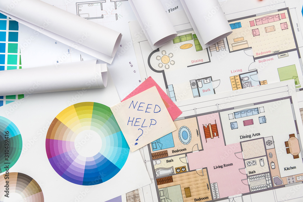 Colour palettes with house plan on desk top view. Designer working at new project Colour palettes with house plan on desk top view. Designer working at new project