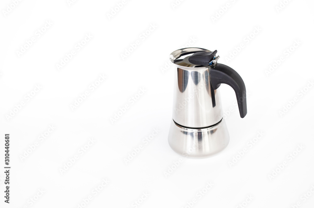 Metallic coffee maker isolated on the white background. Kitchenware for preparing coffee with copy space. Espresso maker, top view. Metallic coffee maker isolated on the white background. Kitchenware for preparing coffee with copy space. Espresso maker, top view.