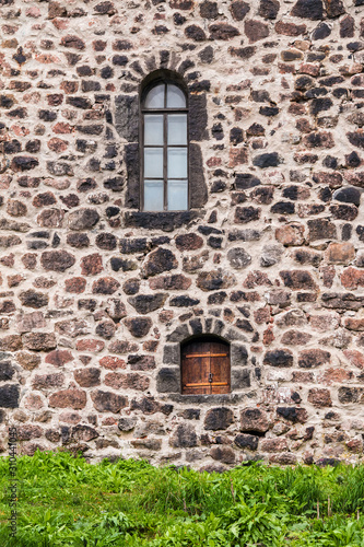 Two windows in the stone wall of the Vyborg Castle front view, Vyborg, Leningrad Oblast, Russia © dr_verner