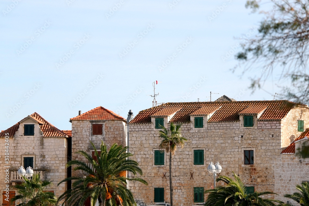Historic stone buildings in town Supetar, on island Brac, Croatia.