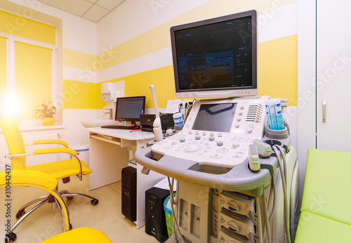 Interior of hospital room with ultrasound machine and bed. Sonography. Health tests concept. Closeup