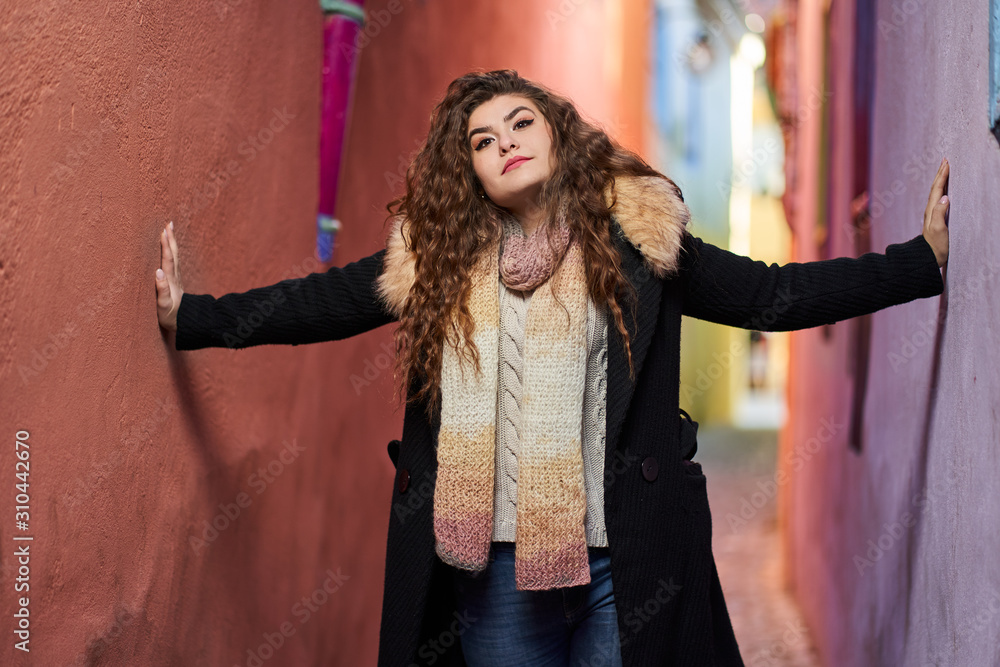 Young woman on a narrow old street Young woman on a narrow old street