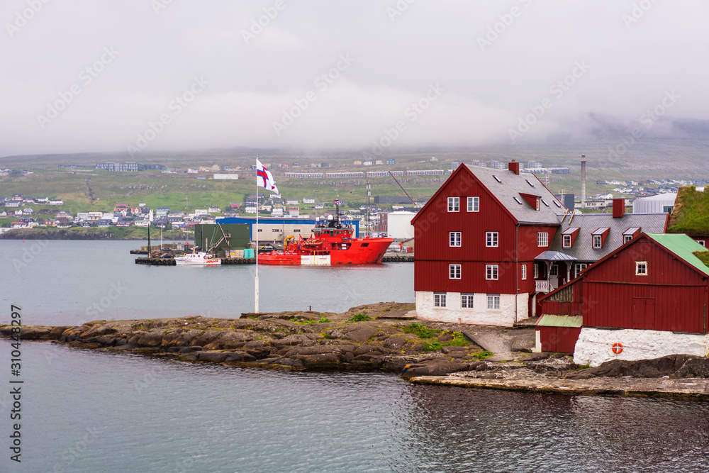 Torshavn harbor panorama with Faroese flag and parlament buildings. Torshavn harbor panorama with Faroese flag and parlament buildings.