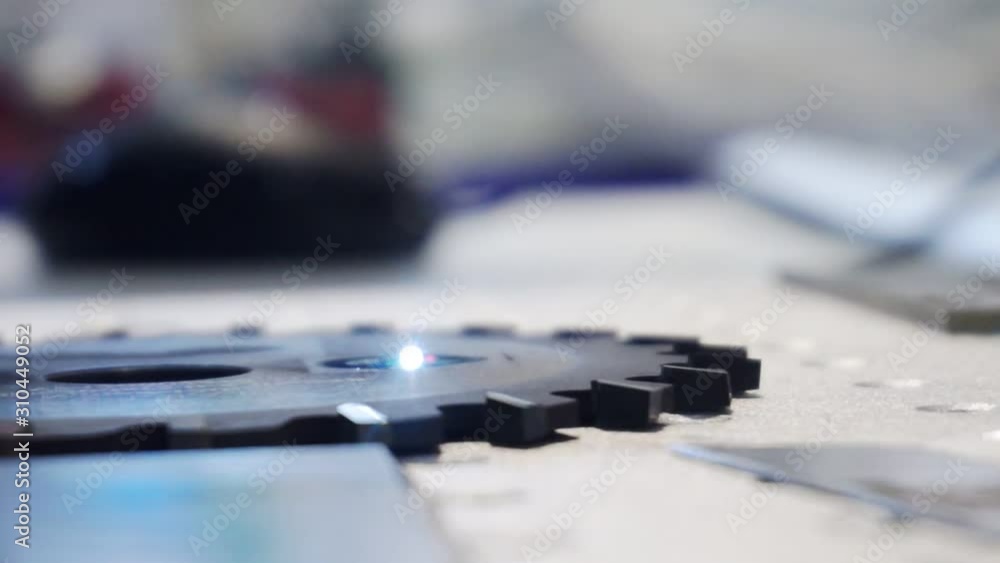 modern laser cnc machine tool processes a metal part.close-up.shallow depth of field. modern laser cnc machine tool processes a metal part.close-up.shallow depth of field.