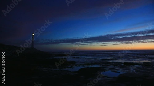 Slangkop Lighthouse near the town of Kommetjie in Cape Town, South Africa at Sunset