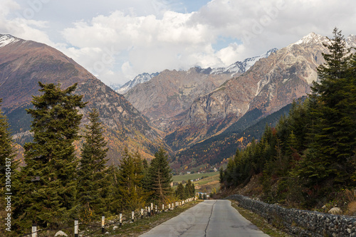 The mountain road runs between the mountains in Svaneti in the mountainous part of Georgia