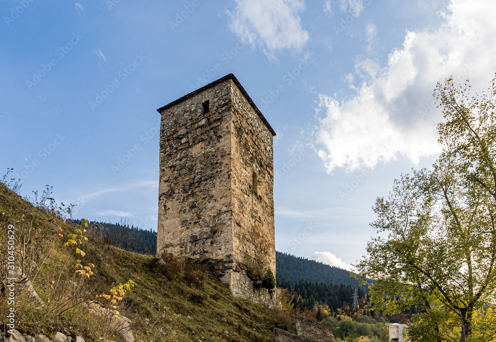 Evenning view of Mestia village in Svaneti and watchtower - Koshki in Svaneti in the mountainous part of Georgia Evenning view of Mestia village in Svaneti and watchtower - Koshki in Svaneti in the mountainous part of Georgia