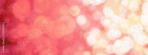Pink abstract background with blurry bokeh circles. The atmosphere of the holiday and luxurious magic. Background for Valentine's day.