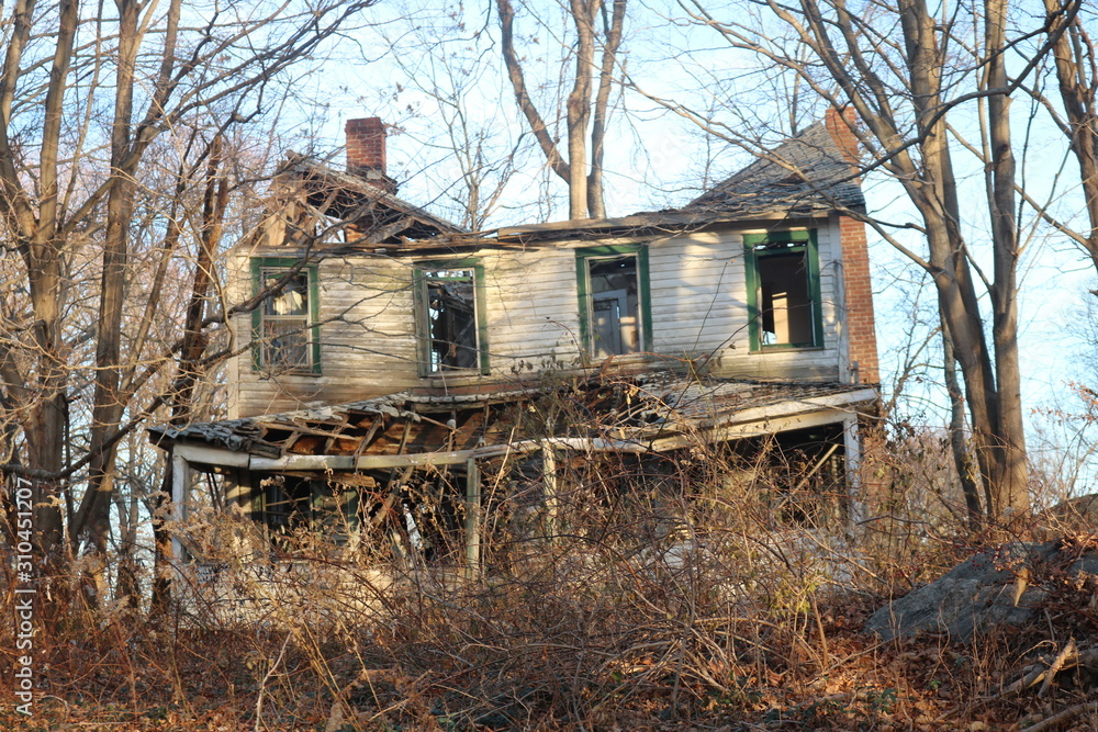 Old abandoned ruined decayed farmhouse in the woods Old abandoned ruined decayed farmhouse in the woods