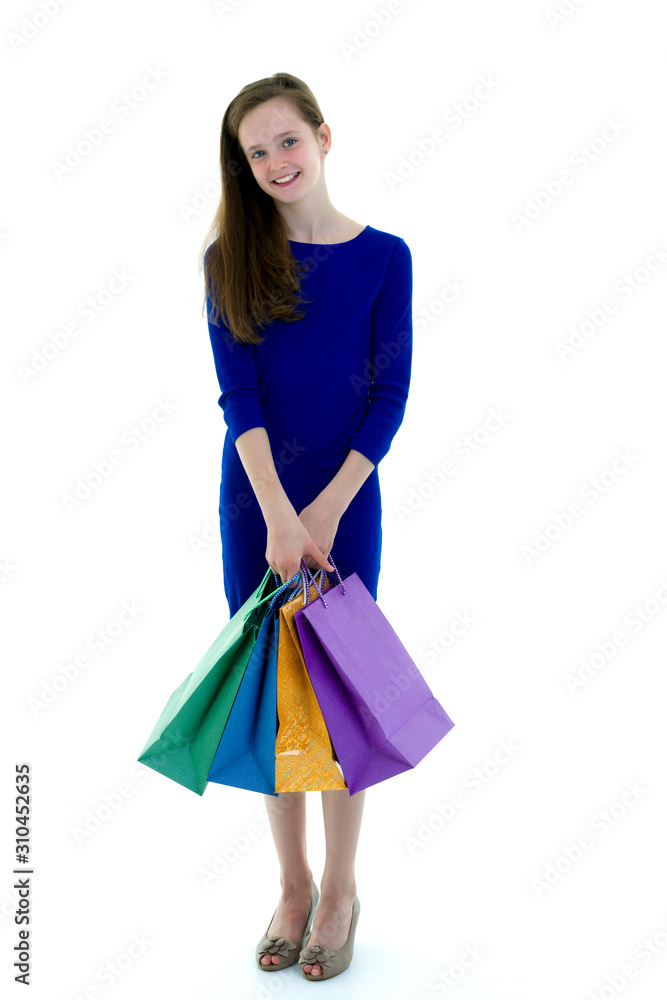 Little girl with multi-colored bags in their hands. Little girl with multi-colored bags in their hands.