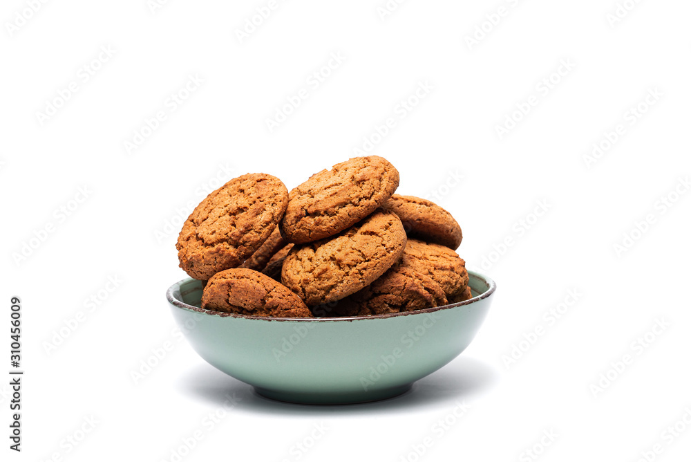 fresh tasty oatmeal cookies in a turquoise plate on a white background fresh tasty oatmeal cookies in a turquoise plate on a white background