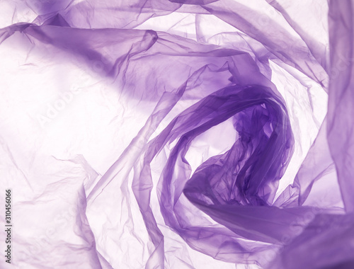Plastic waste pattern of purple bag over white background
