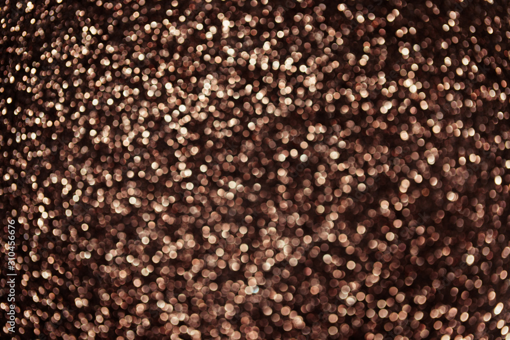 Bronze abstract bokeh background. Bronze Christmas texture. Bronze abstract bokeh background. Bronze Christmas texture.