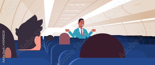 steward explaining instructions for passengers african american male flight attendant in uniform showing emergency exits safety demonstration concept airplane board interior horizontal vector