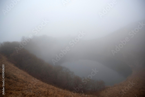 Beautiful view of foggy Shadhurey lake in autumn Russia