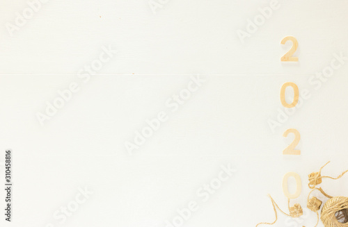 Eco New Year 2020 White Wooden Background with Copy Space, Banner. Top View, Flat Lay Festive Composition with Isolated Numbers, Thread and Vintage Gift Boxes, from Right Side.