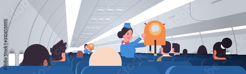 stewardess explaining for passengers how to use jacket life vest in emergency situation female flight attendants safety demonstration concept modern airplane board interior horizontal portrait vector