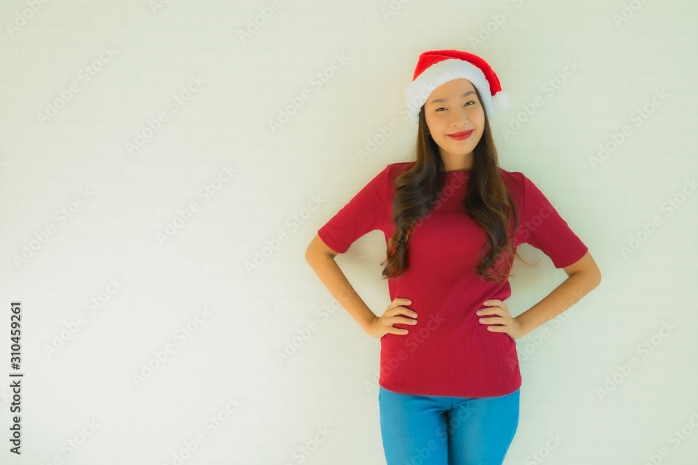 Portrait beautiful young asian women wearing santa hat for celebration in christmas Portrait beautiful young asian women wearing santa hat for celebration in christmas