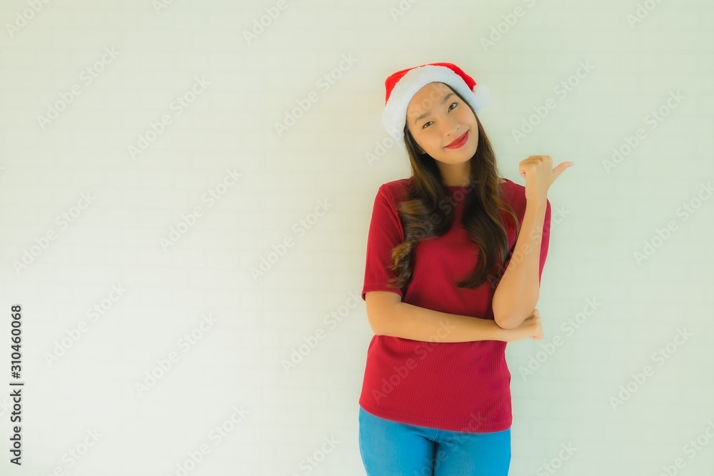 Portrait beautiful young asian women wearing santa hat for celebration in christmas Portrait beautiful young asian women wearing santa hat for celebration in christmas