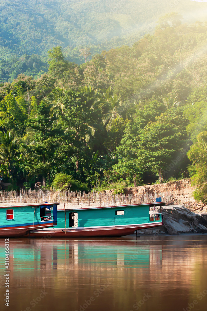 Traditional Laos ferry boats on the Mekong River.