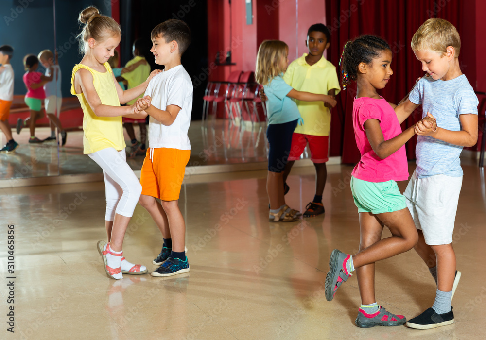 Group of kids dancing salsa dance