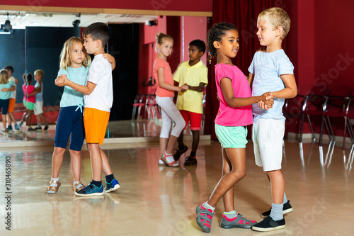 Children trying partner dance in class