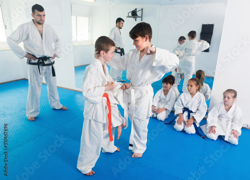 Young children trying in sparring to use new moves