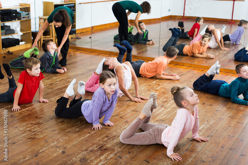 Children exercising in dance hall