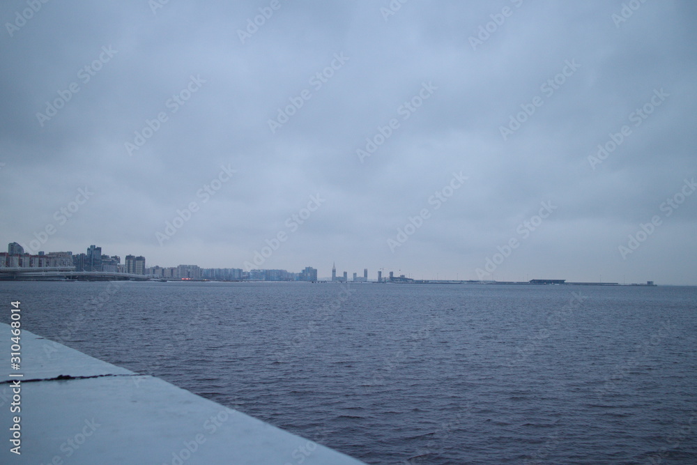 Gulf of Finland coast on a winter evening city with lights