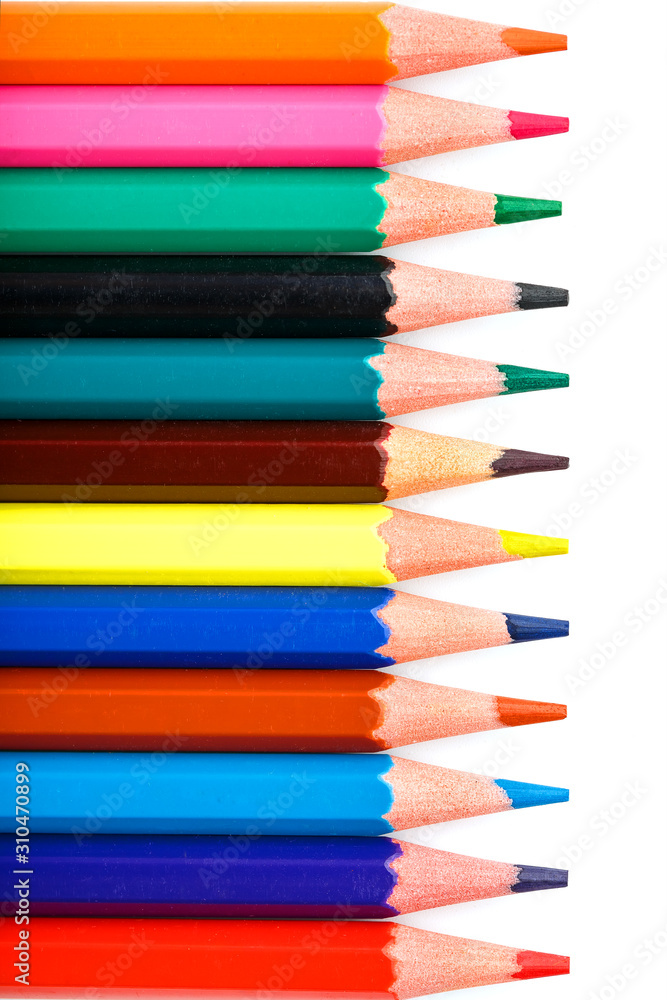 Colored pencils in a row on a white background, free space for text.