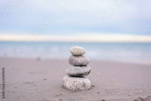 tranquil sea with balanced rocks