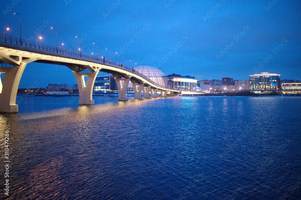 Large bridge illuminated on a winter evening