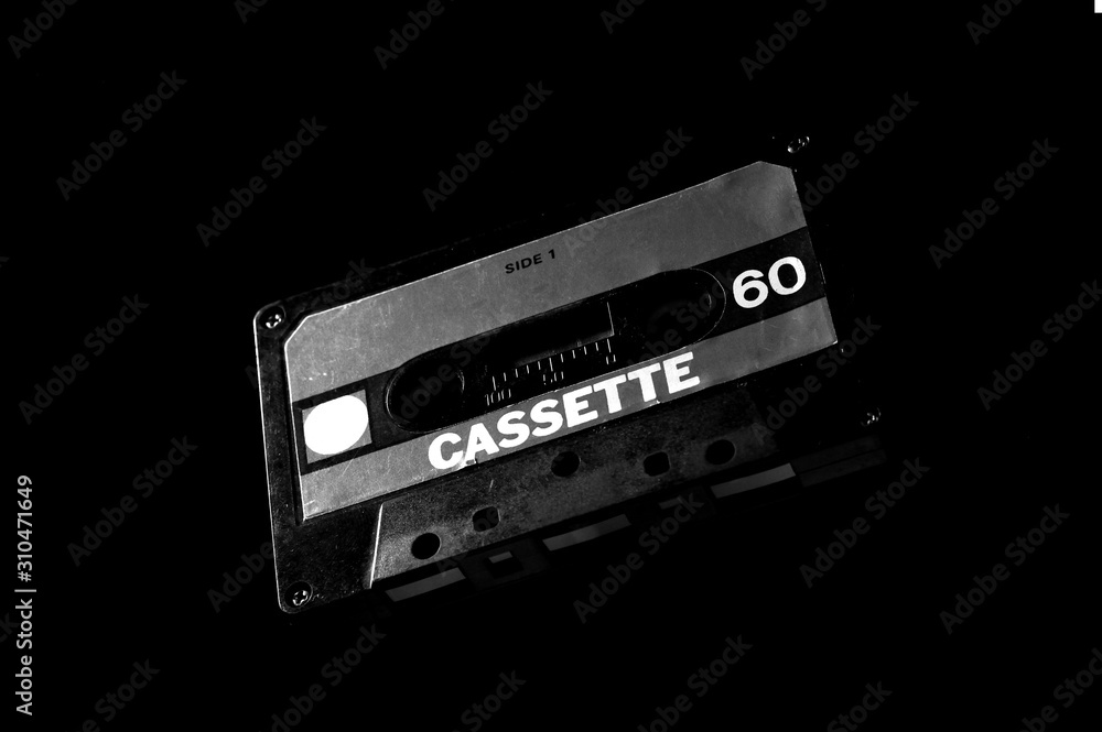 Obraz premium black audio cassette on dark background