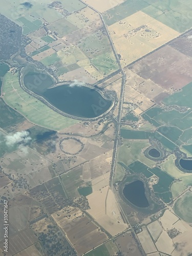 A mixture of dams and fields seen from a plane