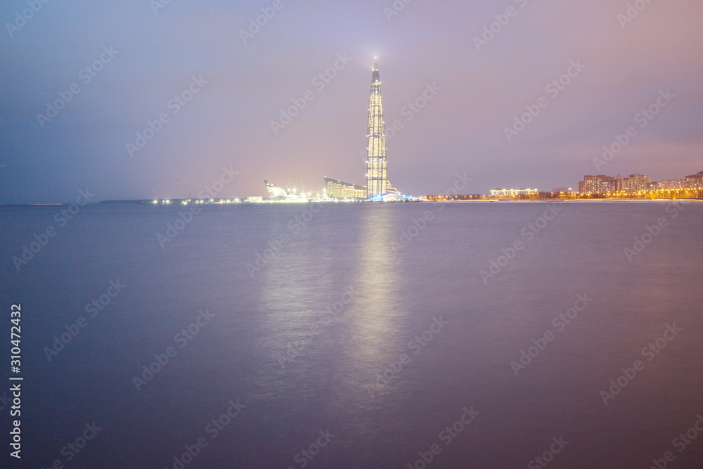 Gulf of Finland coast on a winter evening city with lights