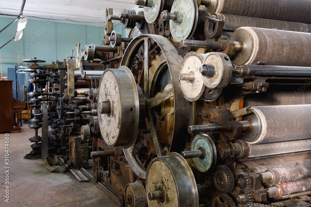 Old broken looms in an abandoned textile factory Old broken looms in an abandoned textile factory
