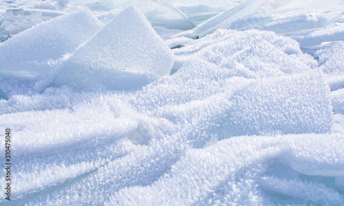 Broken ice on surface of frozen lake in Russia, Baikal Lake in winter, landscape photography