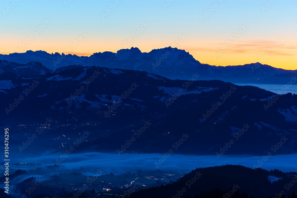 Saentis mountain at sunset. Alpine landscape with colorful sky. Austria, Switzerland